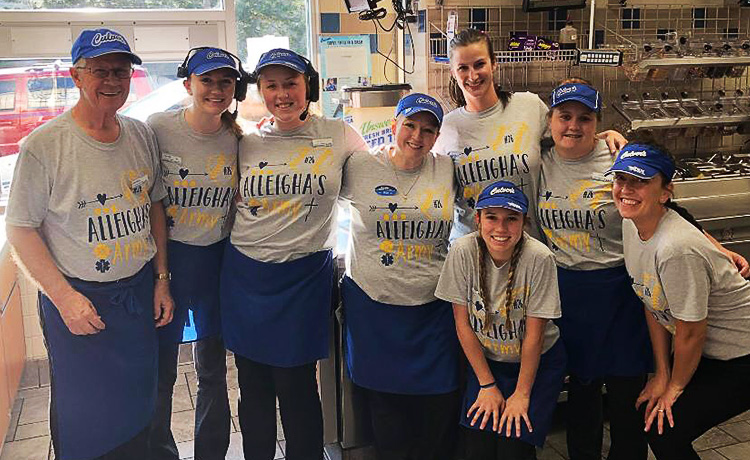 Team members pose for a photo in the restaurant.