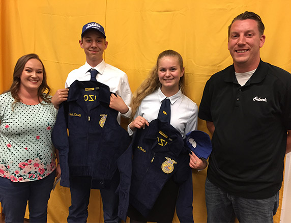 Culver’s of Prescott Valley’s owners, Caleb and Emily Meier, presenting blue jackets to FFA members.