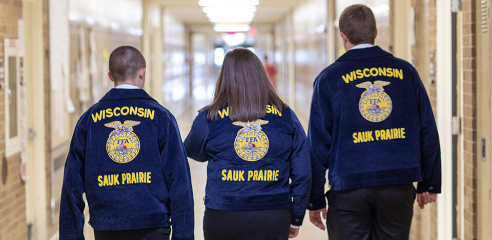 Group of FFA members walking through hall