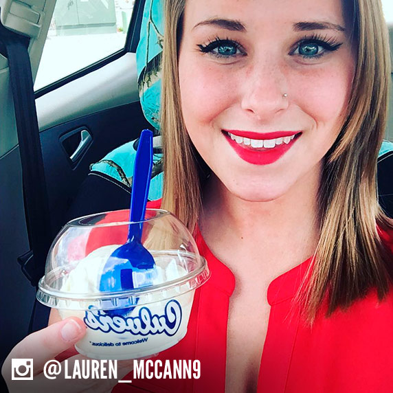 Girl poses in her car with a scoop of Vanilla Fresh Frozen Custard in a dish.